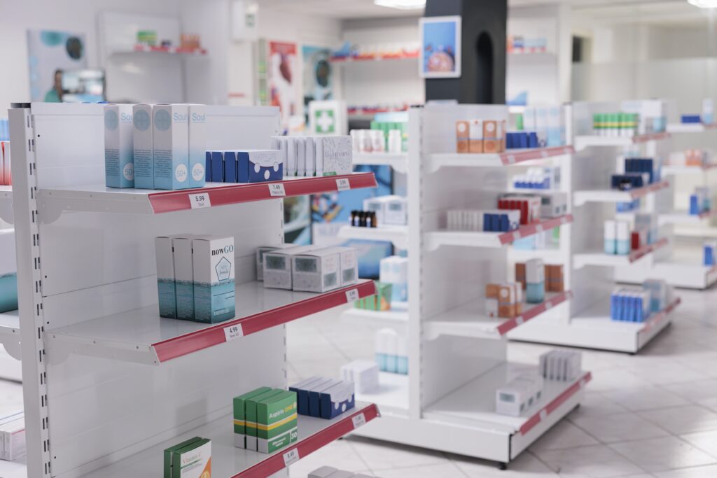 drugstore with bottles packages full of medicaments, retail shop